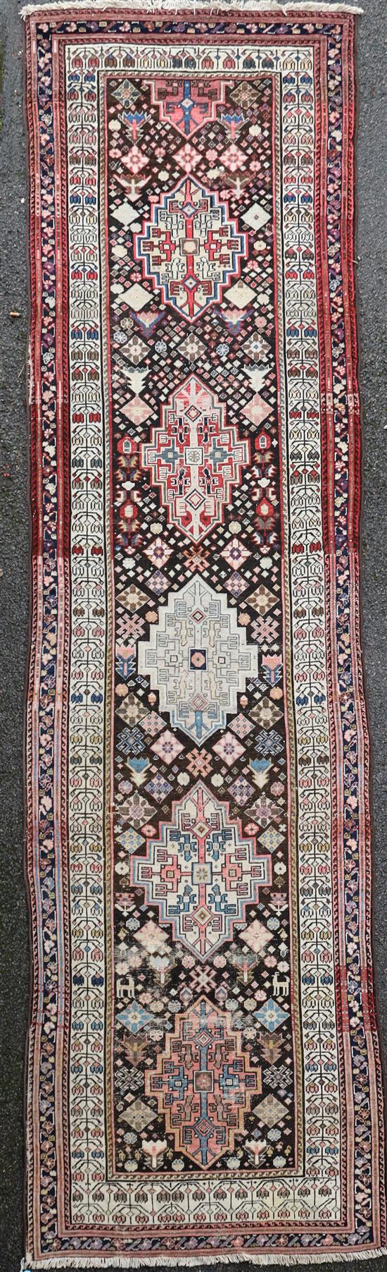 A Persian ivory ground runner, 13ft 2in by 4ft 4in.